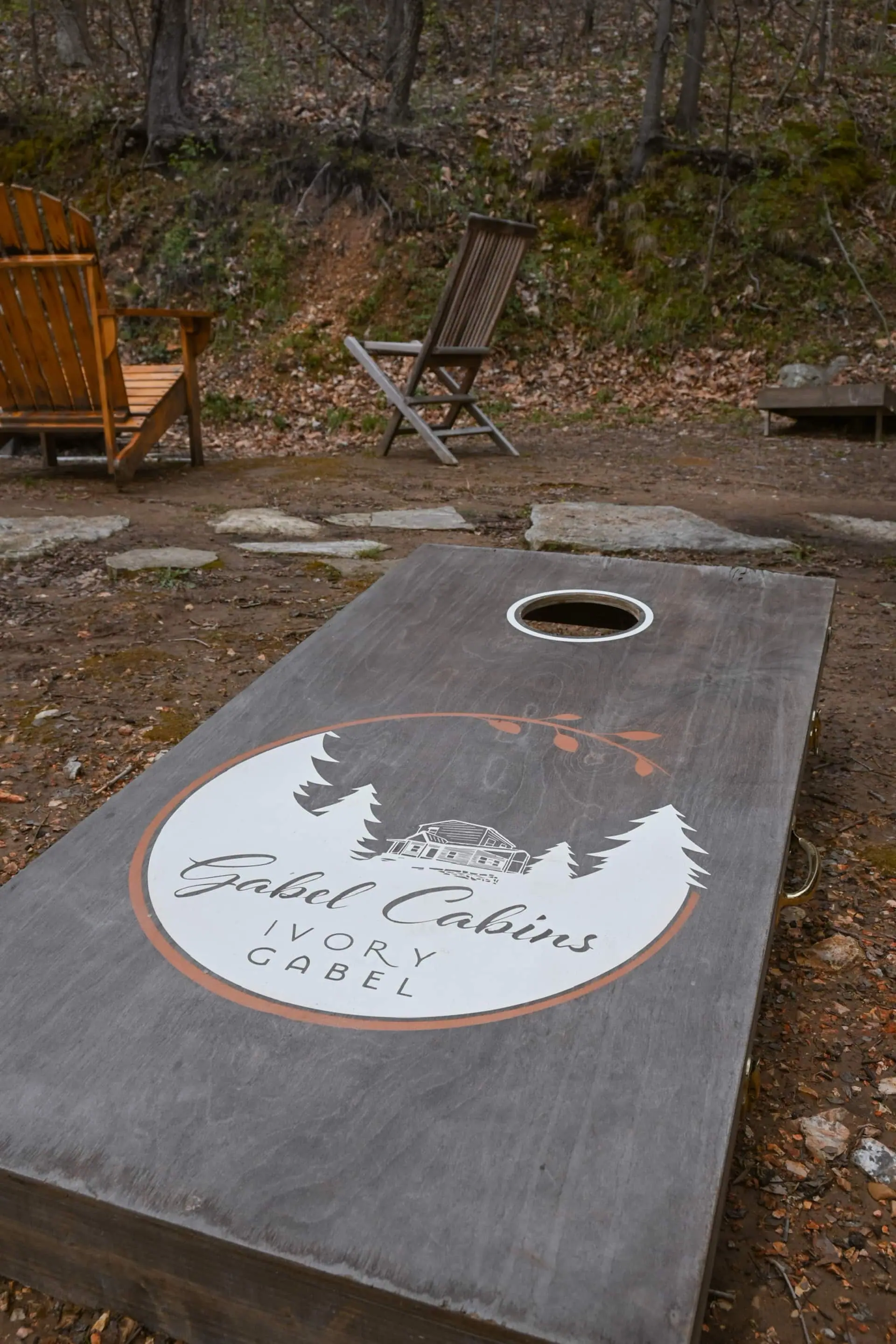 A Gabel Cabins “Ivory Gabel” cornhole board set up in the yard